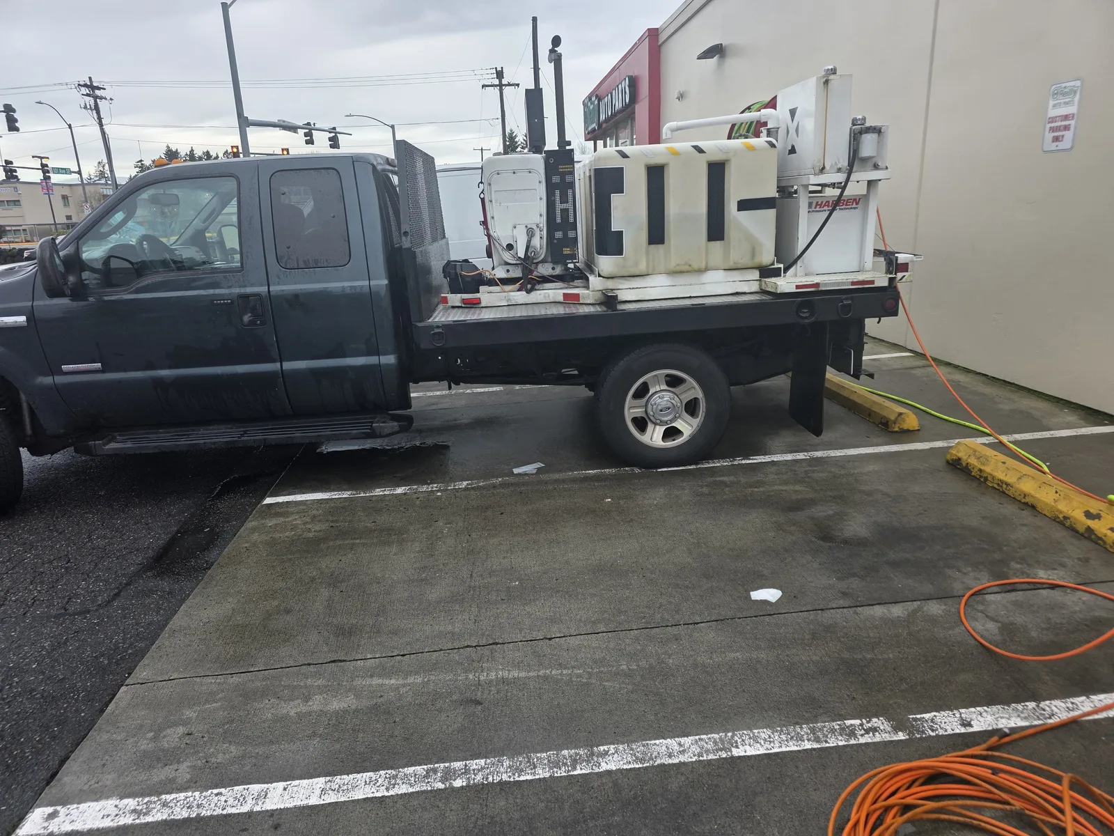 Elite Plumbing service truck carrying a hydro jetting rig